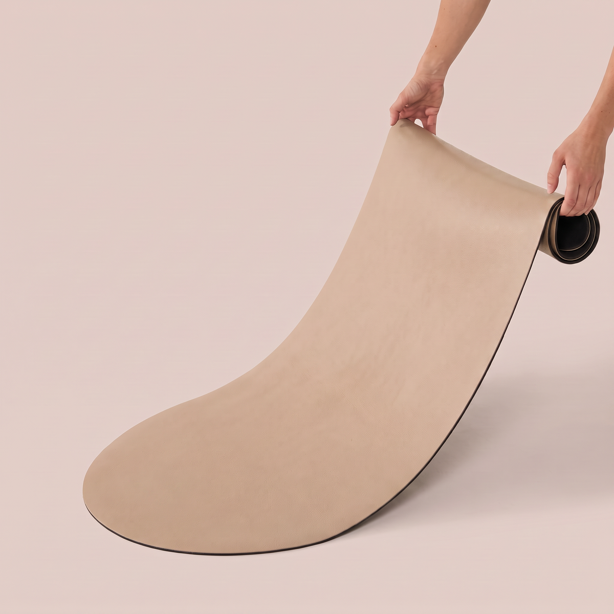 beige pilates mat on white background
