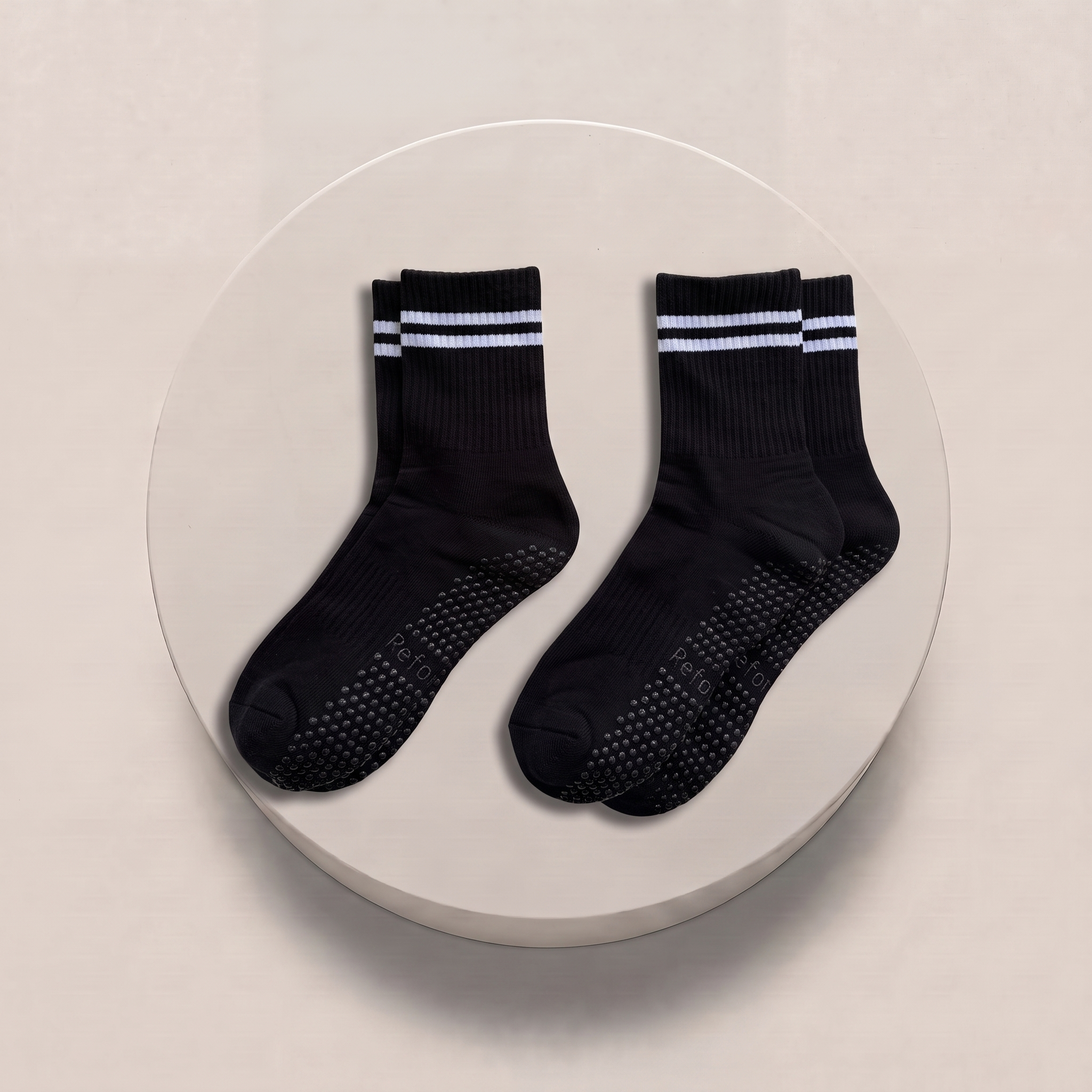 black pilates grip socks on podium