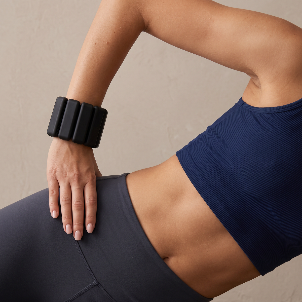 woman wearing black pilates wrist weights